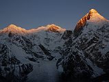 21 First Rays Of Sunrise On Pungpa Ri, Shishapangma East Face, Phola Gangchen From Kong Tso The first rays of sunrise silhouette Pungpa Ri, the Shishapangma East Face and Phola Gangchen from Kong Tso camp (5198m).